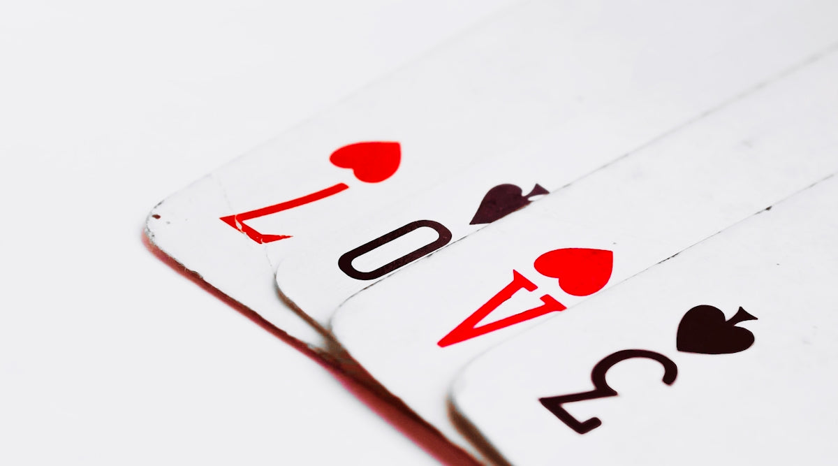 a close up of a playing card with four of spades