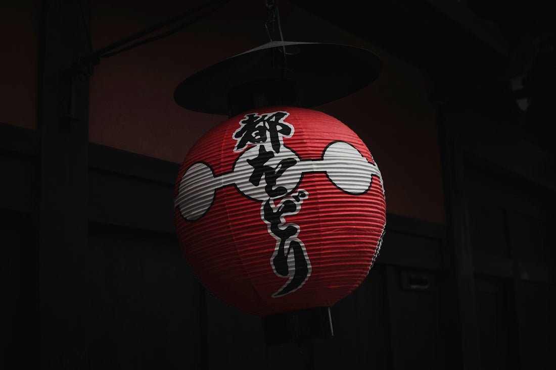 red and white paper lantern hanging outside house
