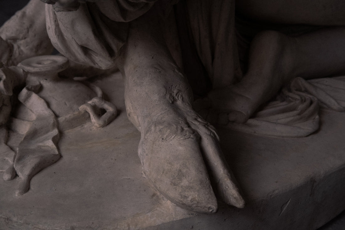 person sitting on concrete floor