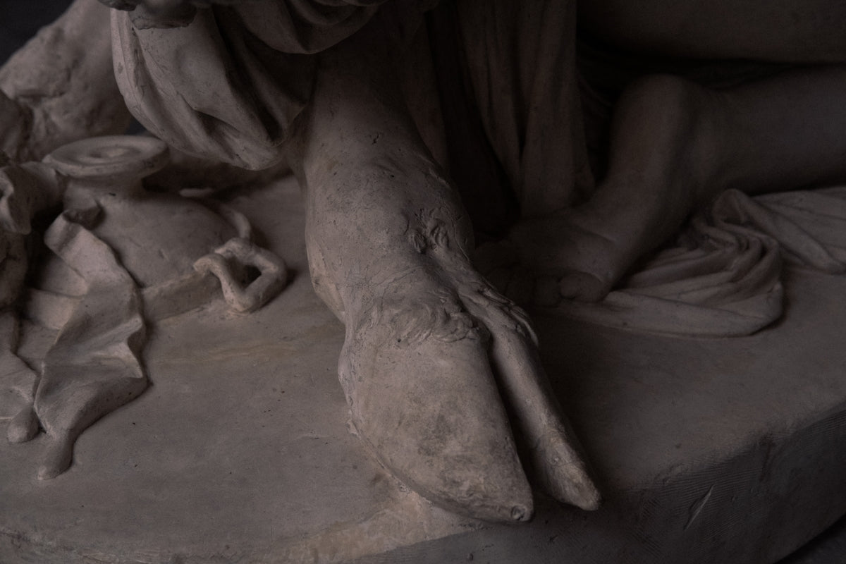 person sitting on concrete floor