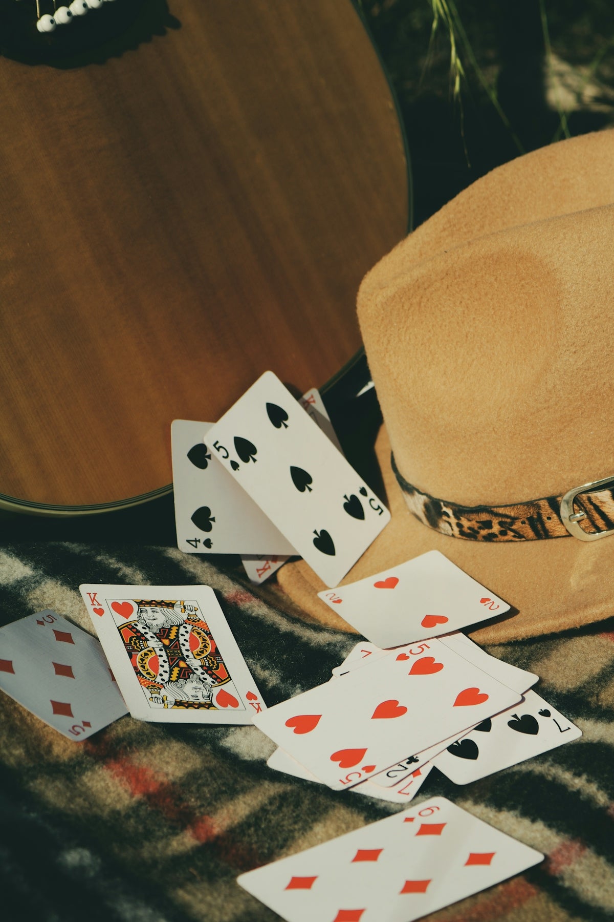 6 of diamonds and 6 of diamonds playing cards on brown wooden table