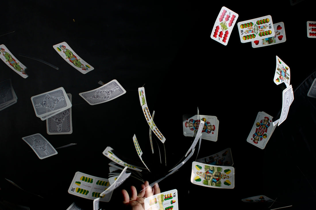 playing cards on black textile