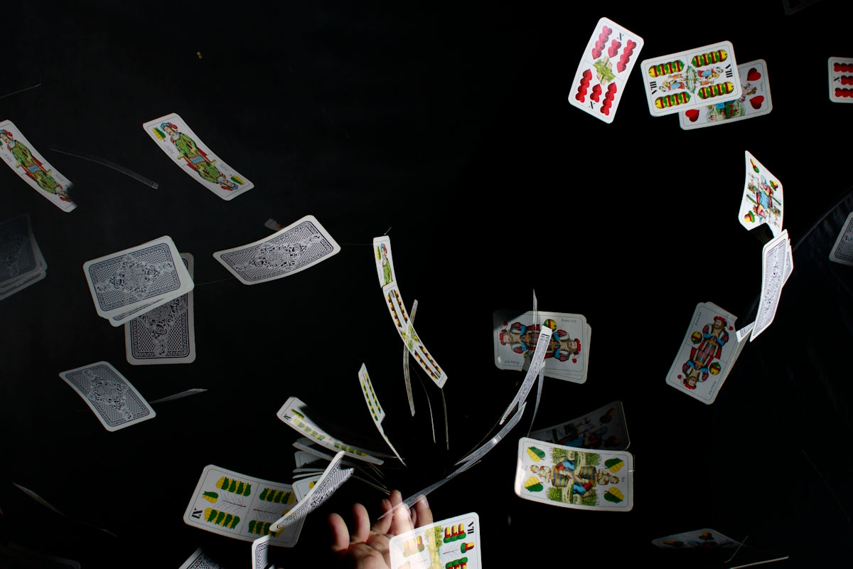 playing cards on black textile