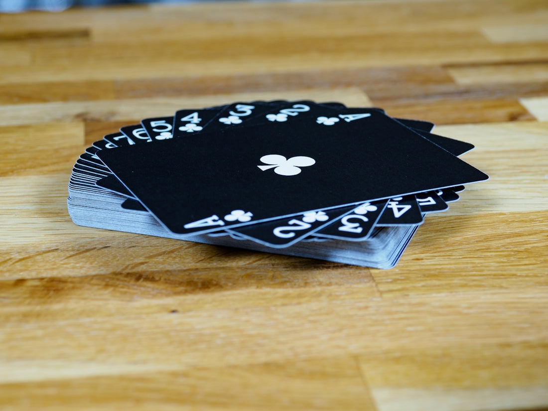 black and white floral book on brown wooden table