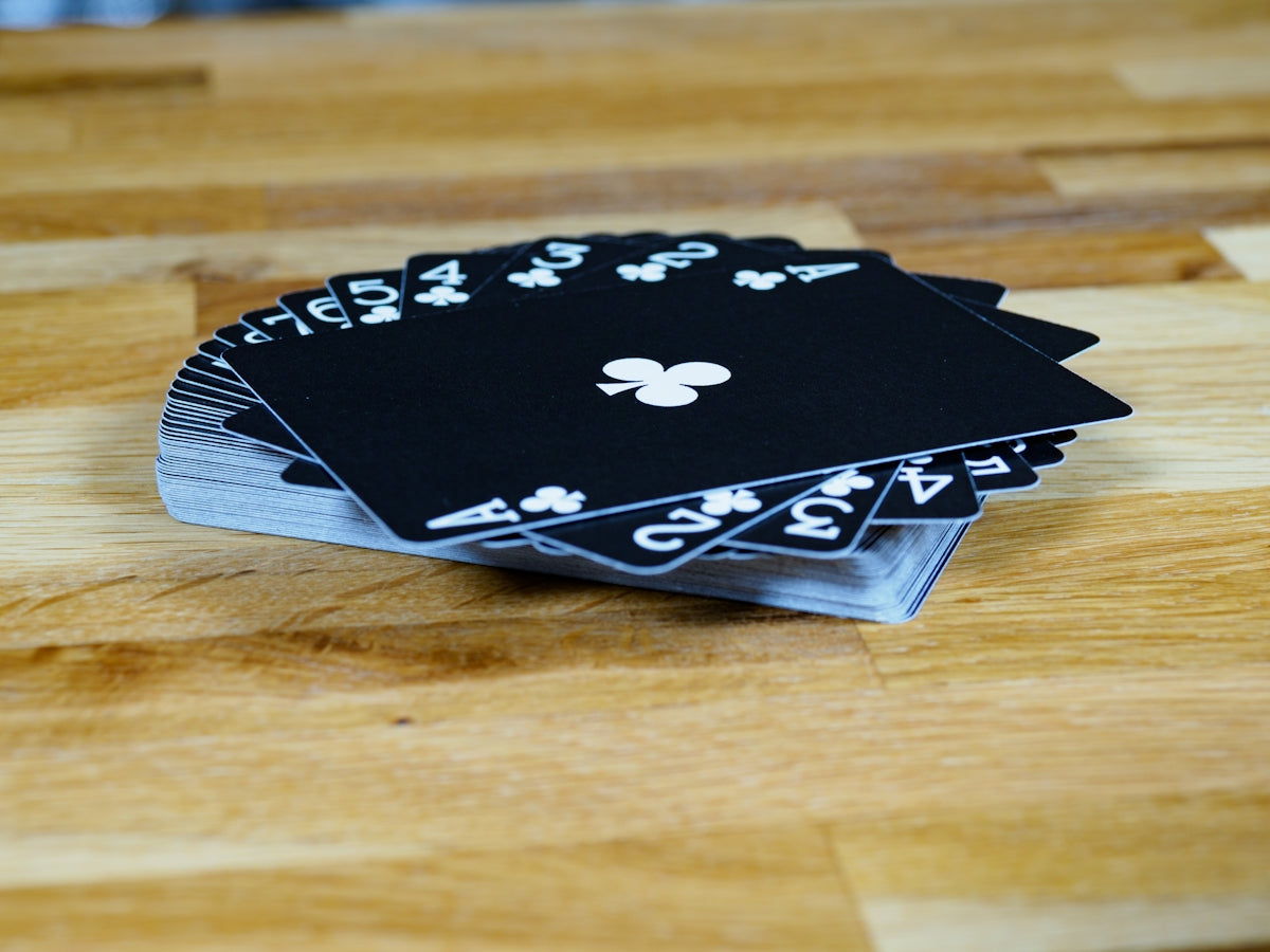 black and white floral book on brown wooden table