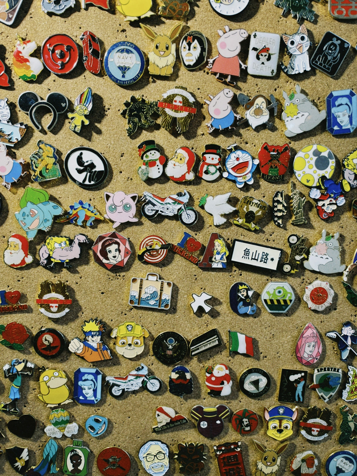 a wall covered in lots of different types of badges