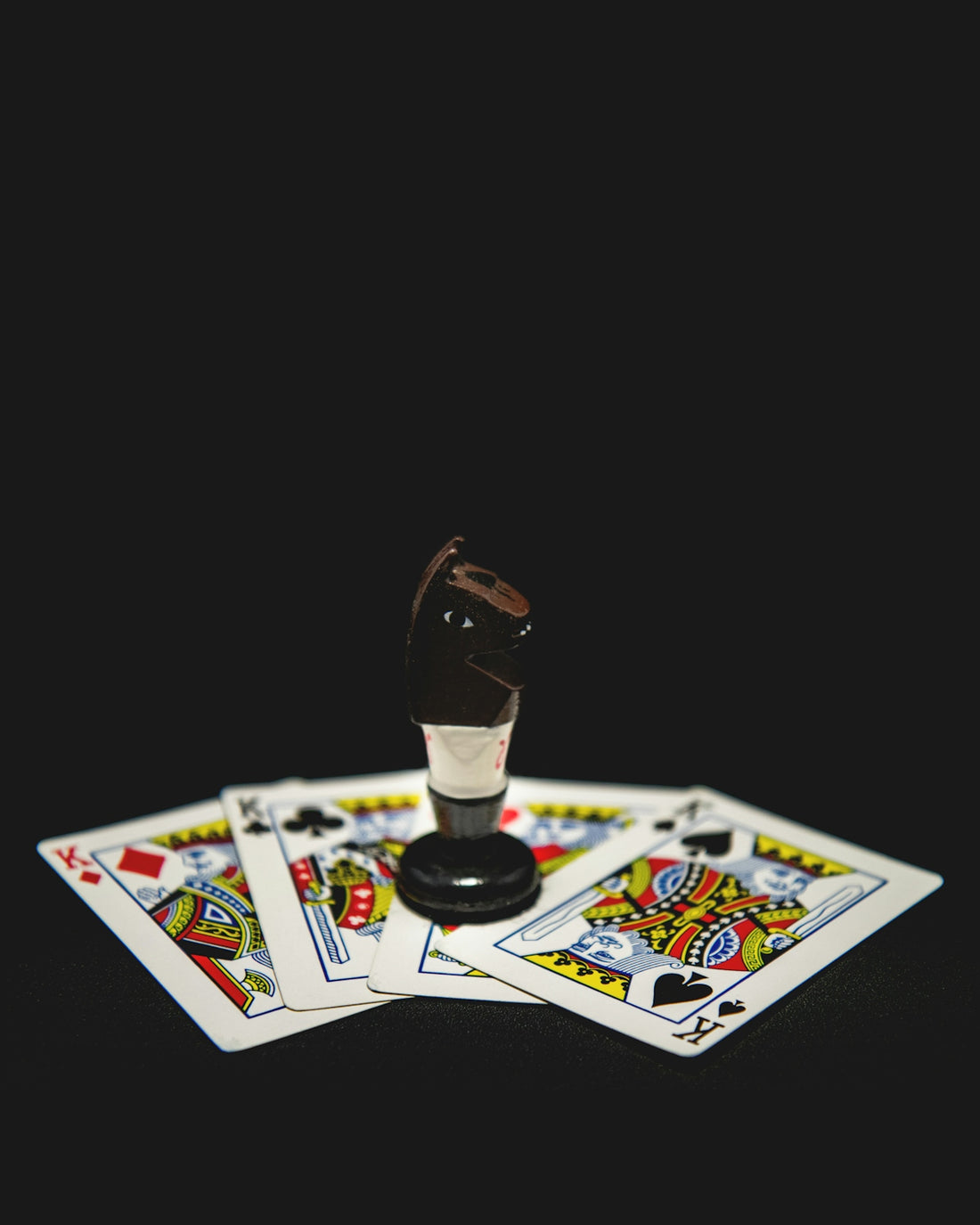 a set of four playing cards and a game of cards