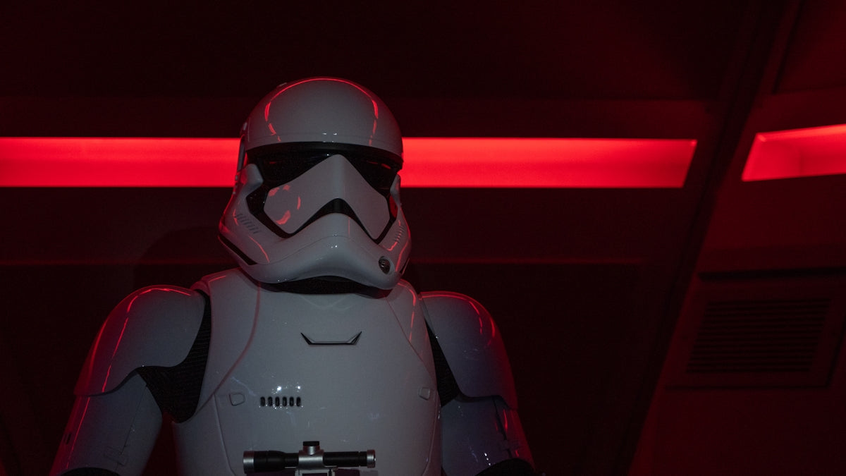 a star wars character in a dark room