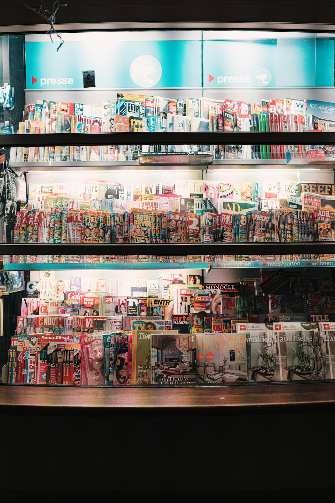 a large display of magazines in a store