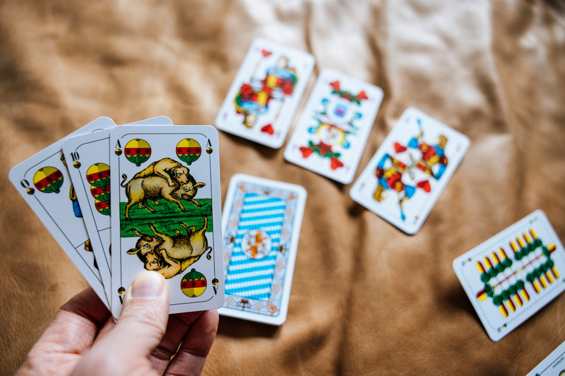 a person holding a deck of cards in their hand