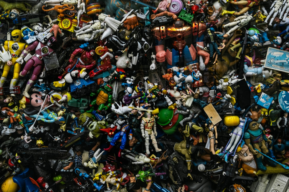 a pile of toy figurines sitting on top of each other