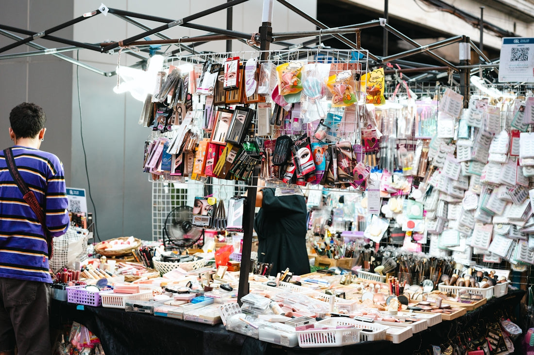 a man standing in front of a table with a lot of items on it