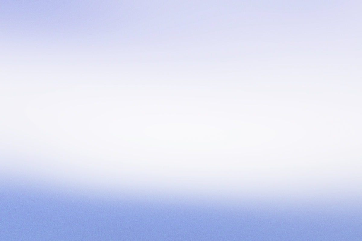 a person flying a kite in a blue sky