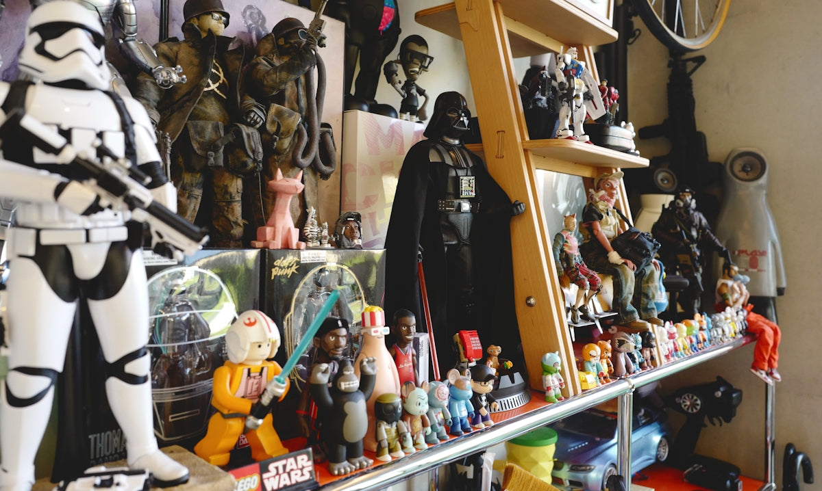 a collection of star wars figurines on a shelf