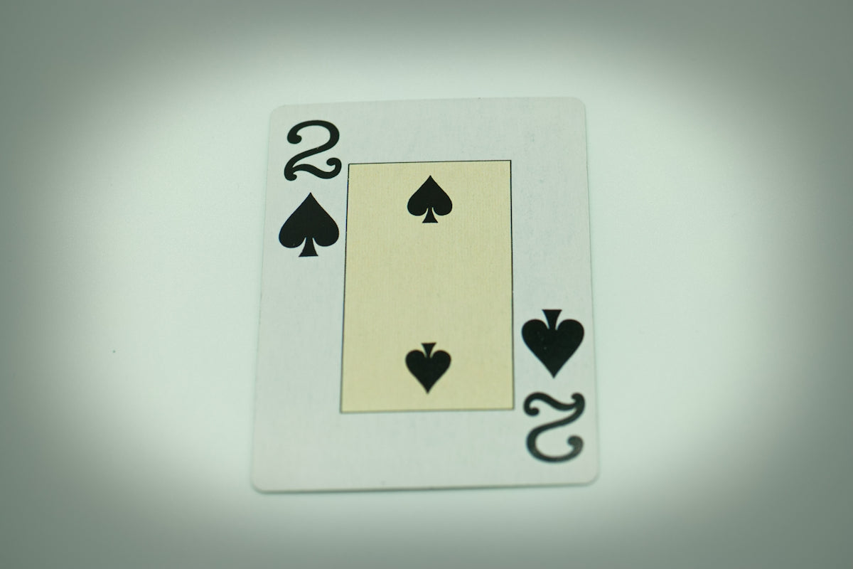a playing card with two hearts and two spades