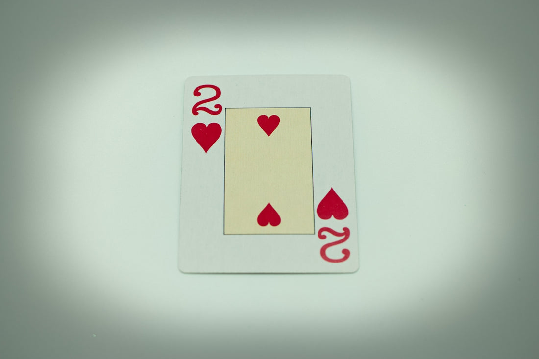 a four of a kind of playing card with hearts on it