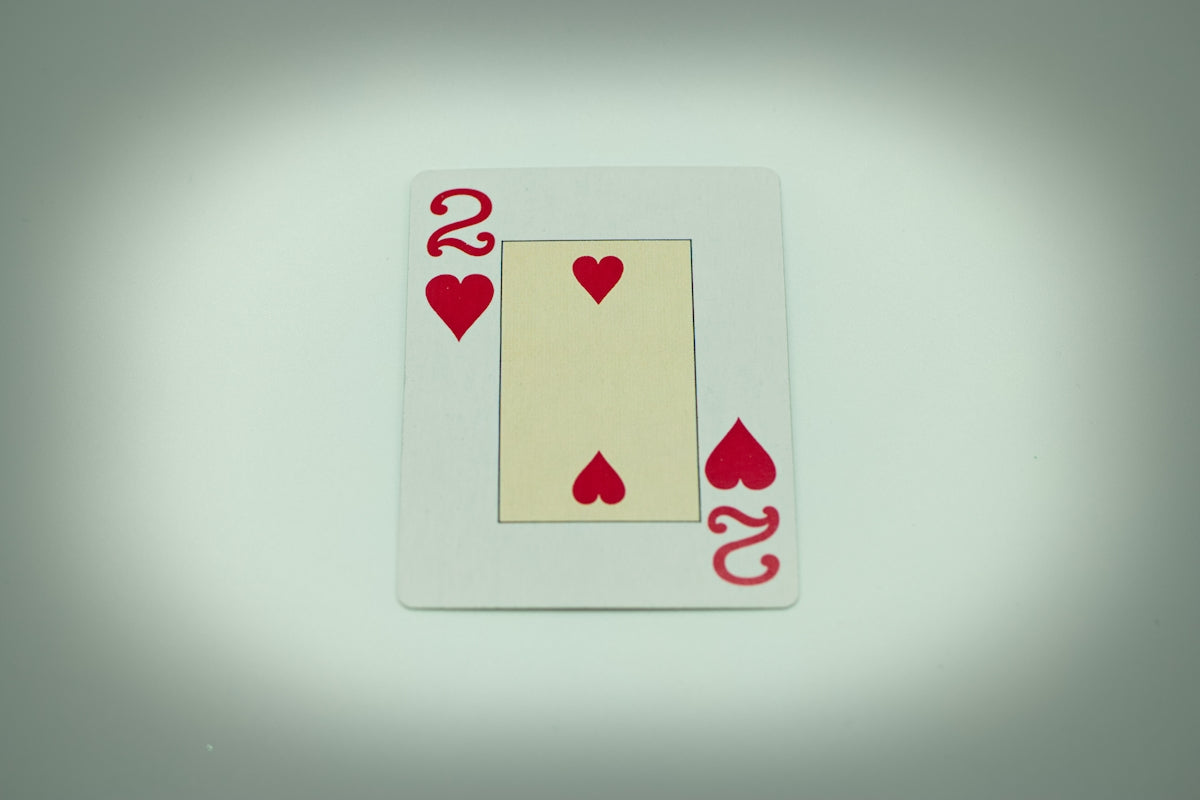 a four of a kind of playing card with hearts on it