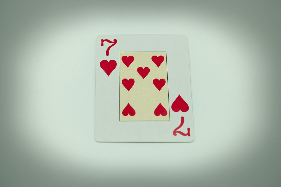 a playing card with hearts on it