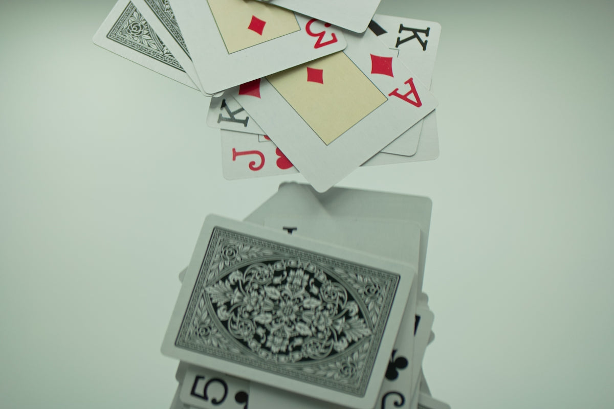 a stack of playing cards sitting on top of each other