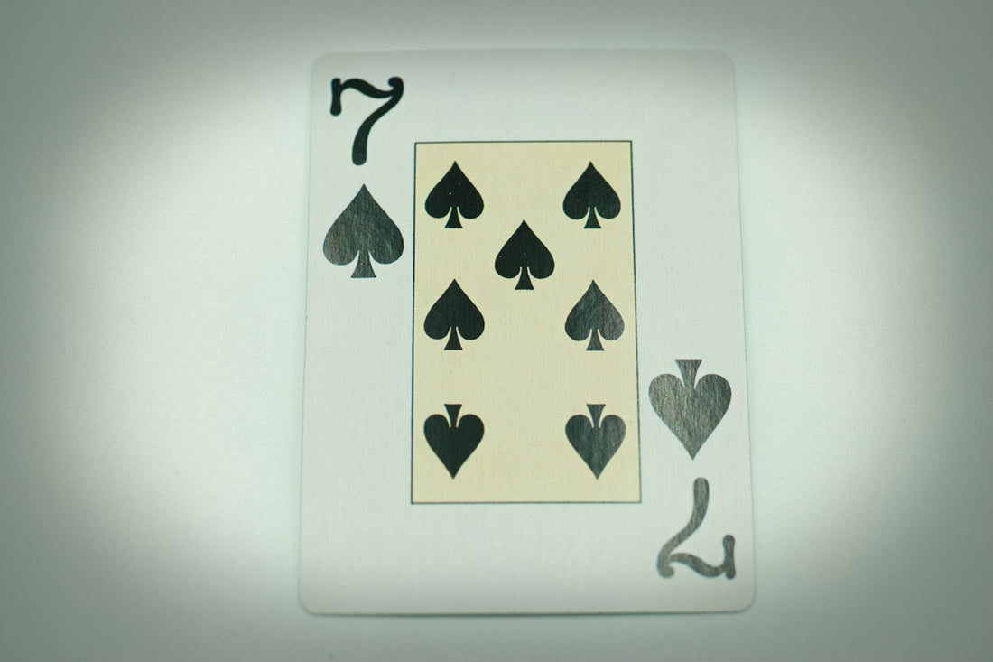a playing card with four of spades on it