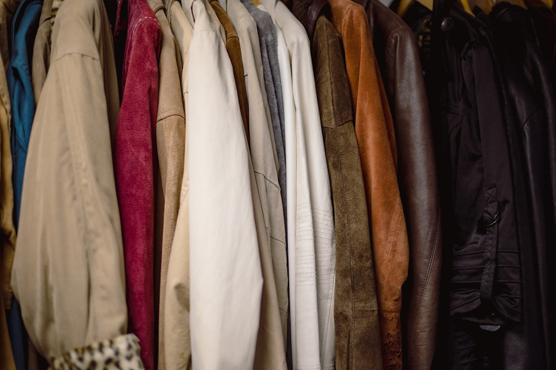 a rack of clothes hanging on a wall