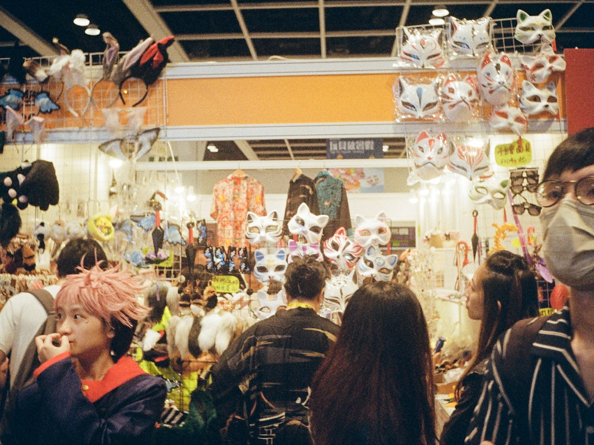 A group of people standing around a store