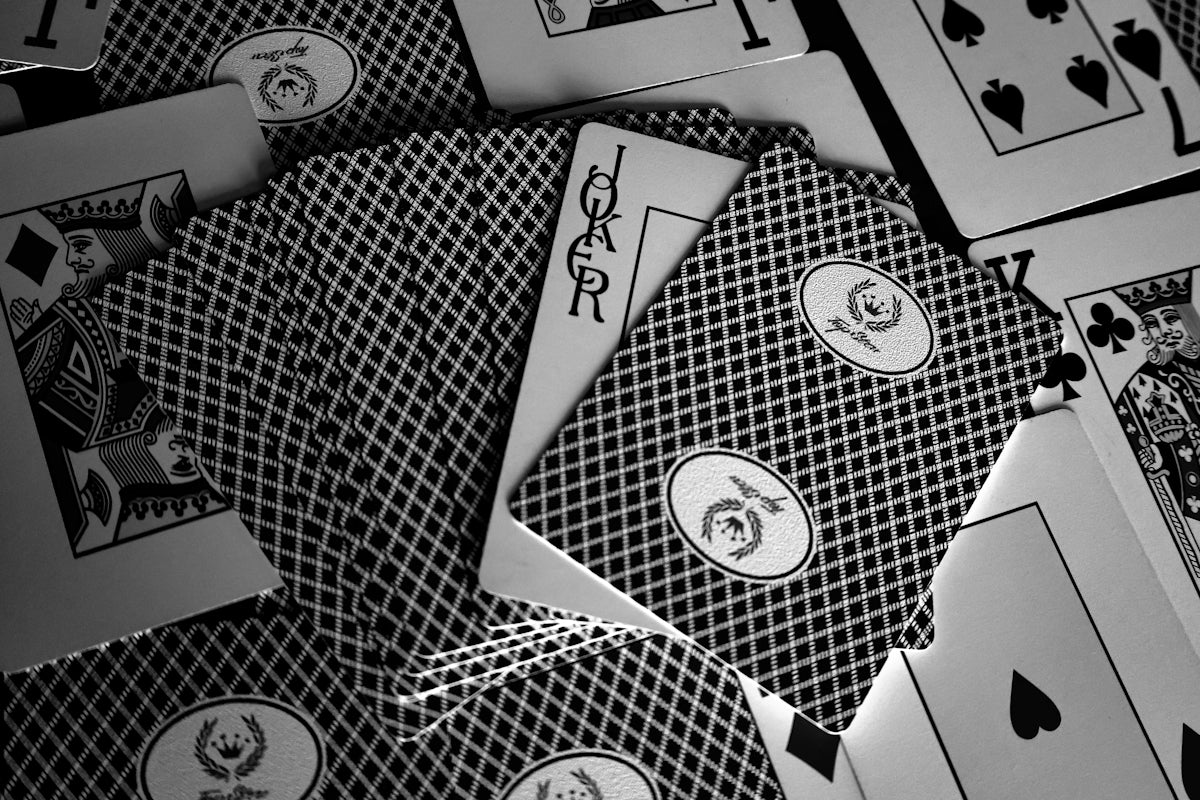 A pile of playing cards sitting on top of each other