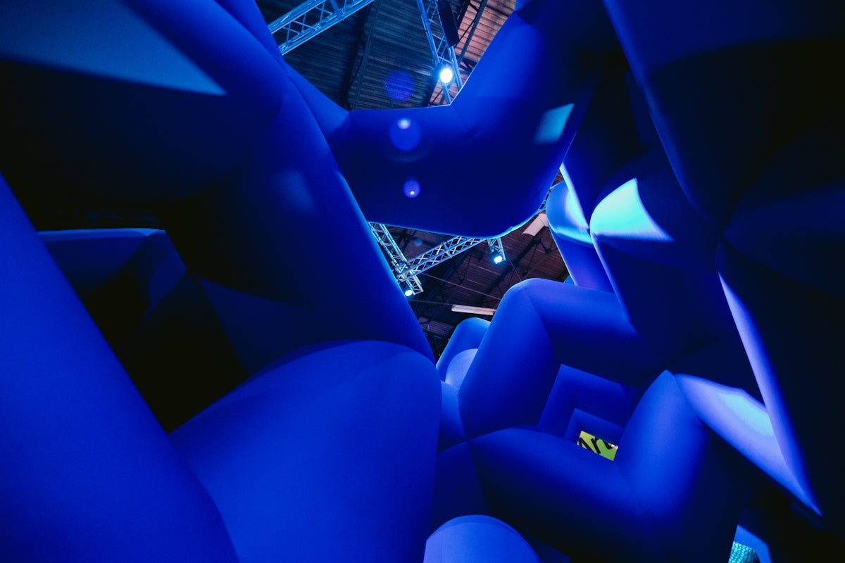 Blue, abstract shapes fill the image.